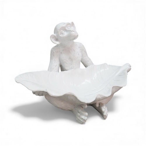 Monkey With Leave On His Lap